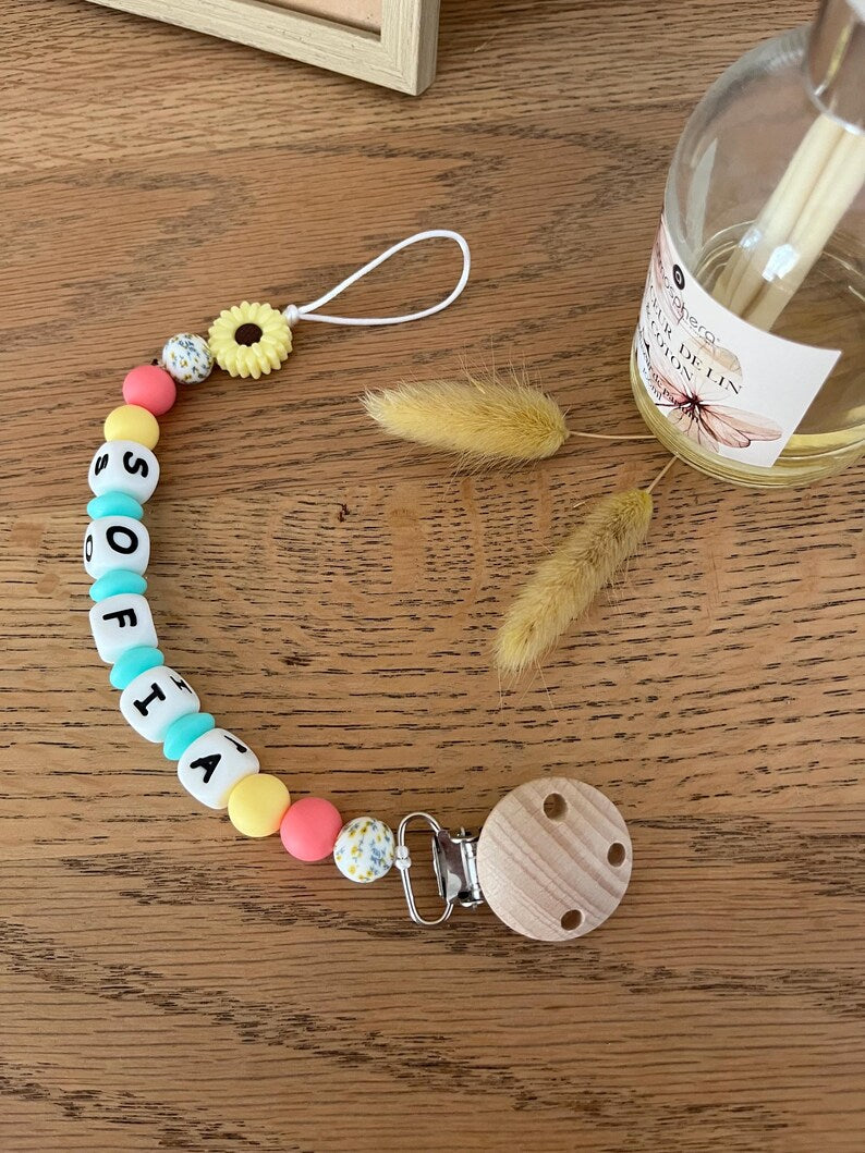 Attache tétine arc en ciel