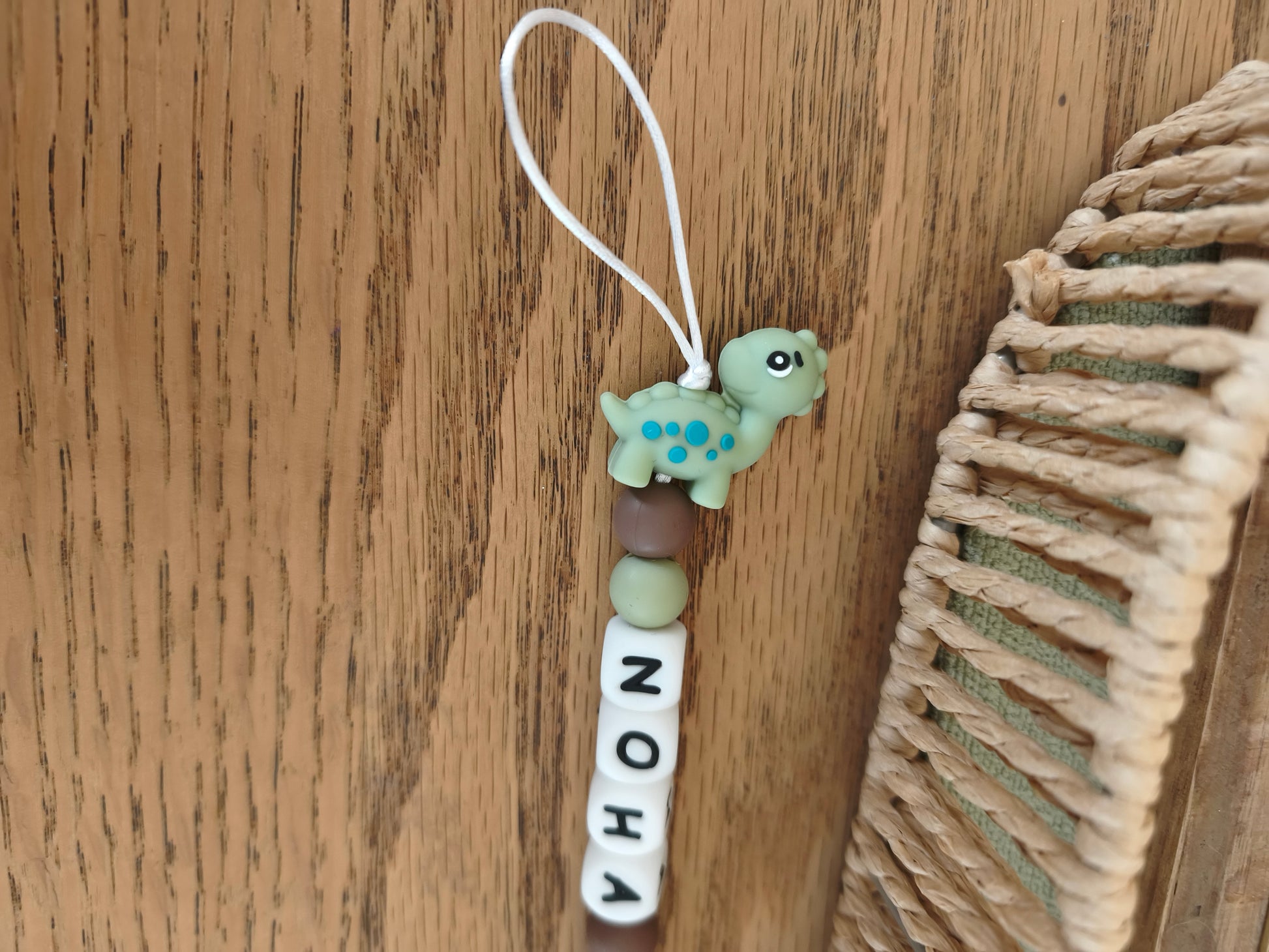 Attache tétine dinosaure