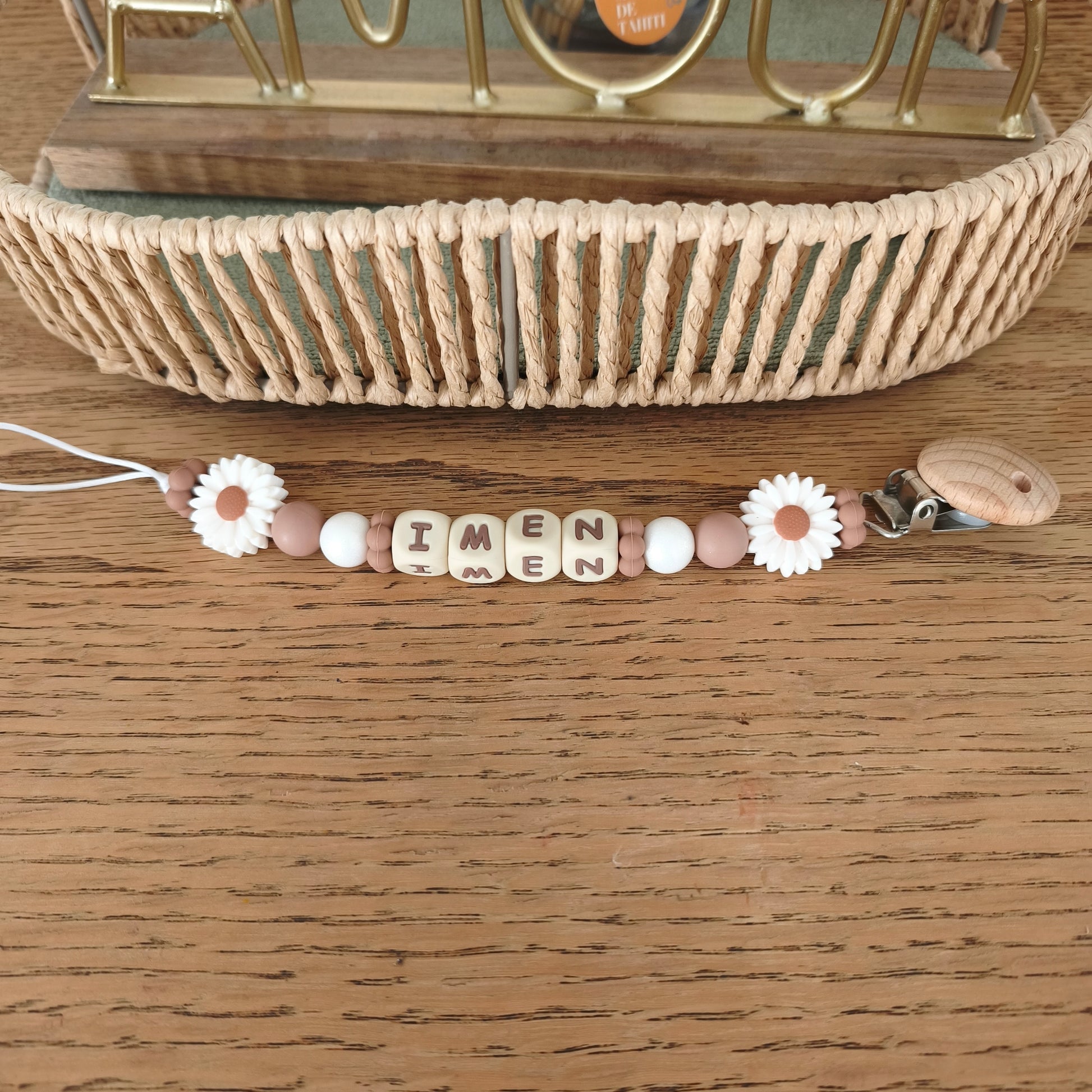 Attache tétine marguerites