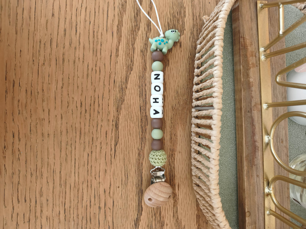 Attache tétine dinosaure